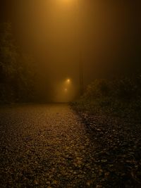 Scenic view of illuminated landscape against sky at night