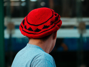 Close-up portrait of teenage boy wearing hat