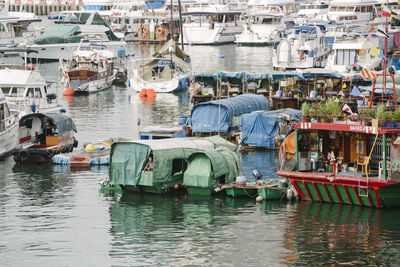 Fishing boats moored at harbor