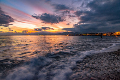 Scenic view of beach against sky during sunset