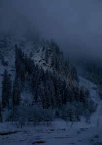 Scenic view of snow covered mountains against sky