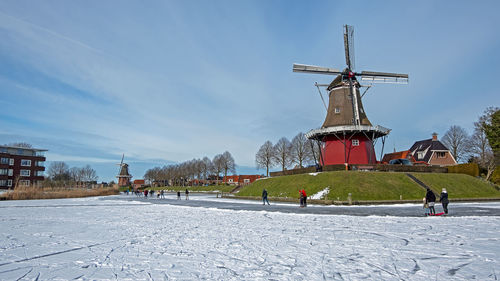 Winterfun near the windmills in dokkum in the netherlands 