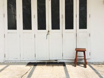 Empty stool by closed door