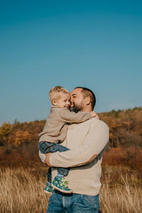 Father's day, happy loving family. father and son playing, having fun on the nature. happy family, 