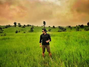 Full length of man standing on field