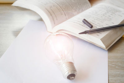 High angle view of light bulb on table