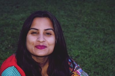 Portrait of smiling woman standing outdoors