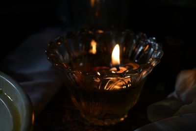 Close-up of tea light candles on table