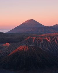 Scenic view of mountains against clear sky during sunset