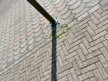 Low angle view of street light against wall