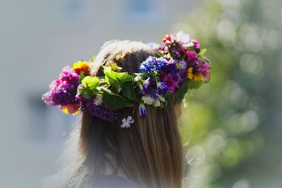 Close-up of girl wearing flowers