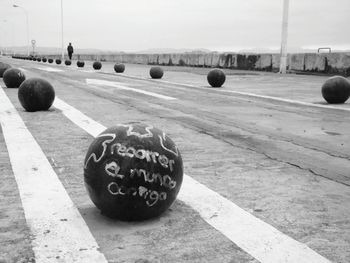 View of ball on field in city against sky