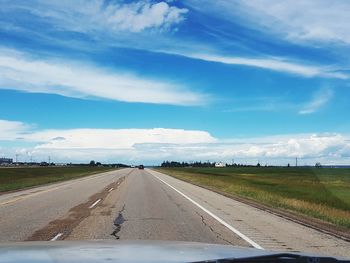 Road seen through car windshield
