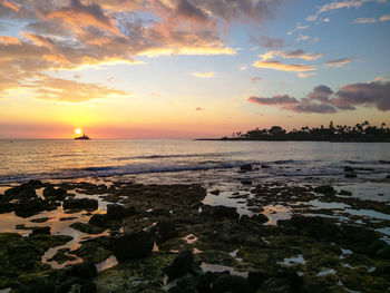 Scenic view of sea at sunset