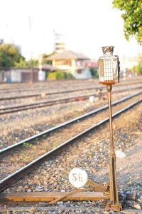 Close-up of railroad station against sky