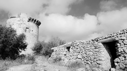 Old building against cloudy sky