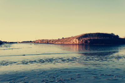 Scenic view of sea against clear sky