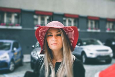 Portrait of beautiful young woman in car