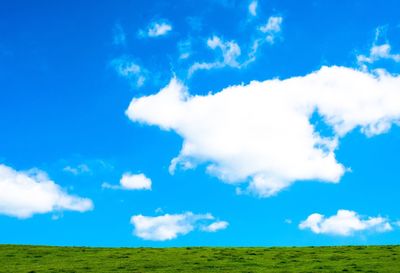 Scenic view of landscape against blue sky