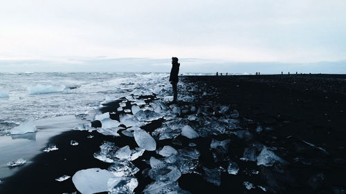 Scenic view of sea against sky during winter
