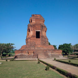 View of temple against clear blue sky