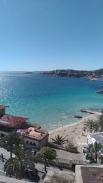 High angle view of swimming pool by sea against clear sky