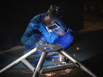 High angle view of man in illuminated container