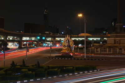 Light trails on road in city at night