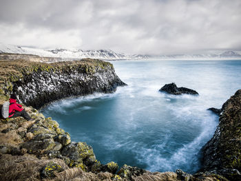 Hiker looking at sea