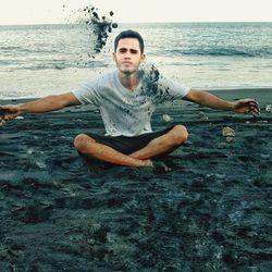 Portrait of young man in sea