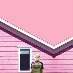 Low angle view of pink building against sky