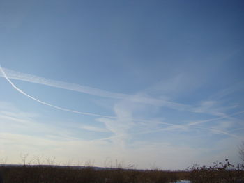 Scenic view of vapor trails in sky