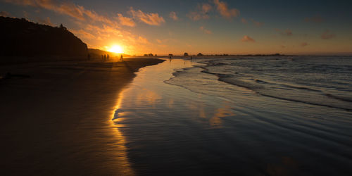 Scenic view of beach during sunset