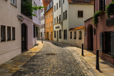 Street amidst residential buildings