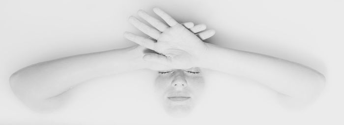 Woman relaxing in milk bathtub