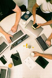 High angle view of man using laptop on table