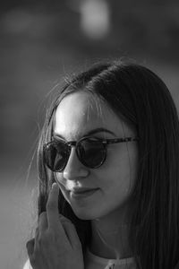 Close-up of young woman wearing sunglasses