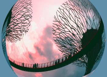 Low angle view of ferris wheel against sky