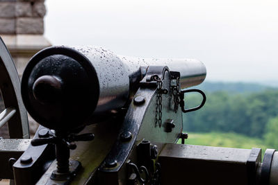 Close-up of old wheel against sky