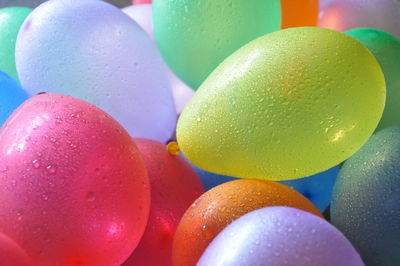 Close-up of wet colorful balloons