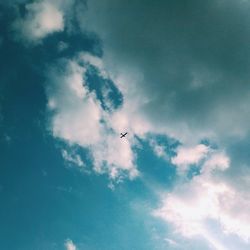 Low angle view of airplane flying in sky