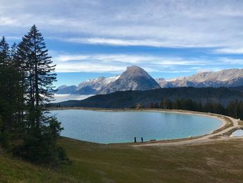 Scenic view of lake and mountains against sky