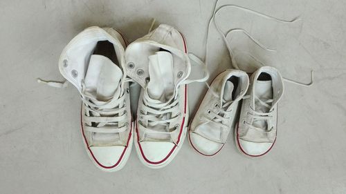Close-up of shoes on sand