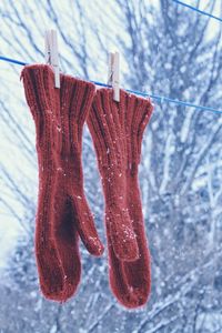 Close-up of clothes hanging on snow