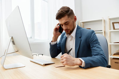 Businesswoman working at desk in office