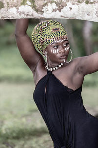 Ghana woman with tribal painting in the forest aburi ghana west africa