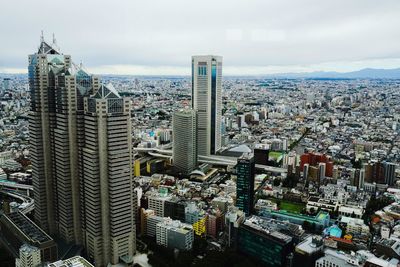 Aerial view of cityscape against sky