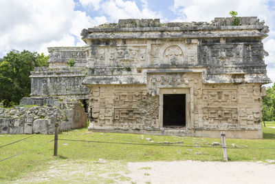 Old ruins of building against cloudy sky