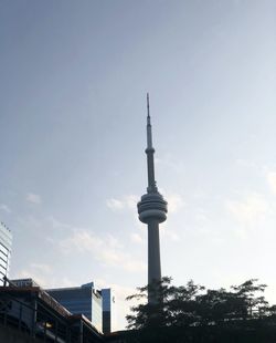 Low angle view of communications tower against sky