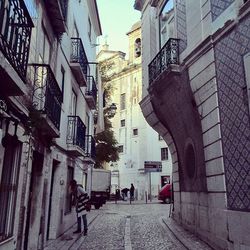 Narrow street along buildings